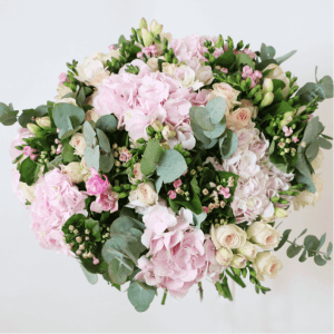 hydrangea, spray rose, bouvadia and eucalyptus