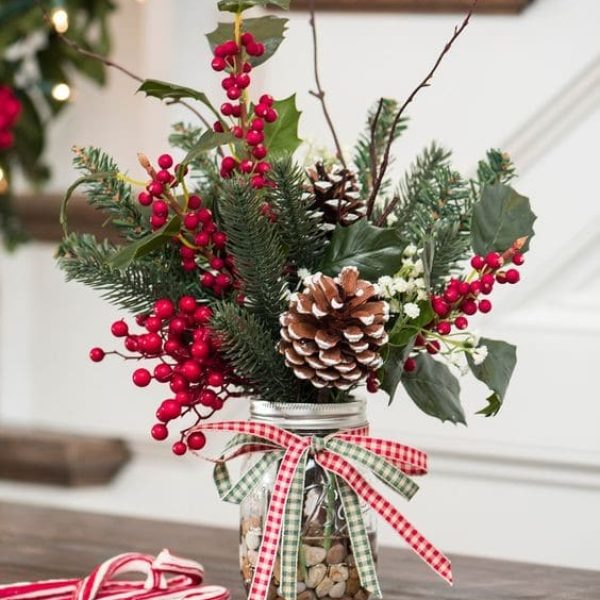 Christmas mason jar filled with foliage