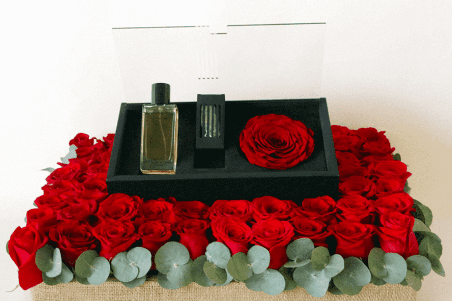 Revealing red perfume and red rose arrangement