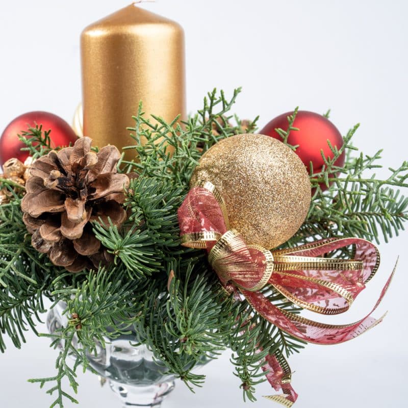 Elegant Centerpiece Arrangement with Candle, Ornaments in Glass Vase